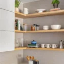Open kitchen with with wooden shelves in a bump-out addition remodel in Eastern Market, Washington DC.