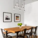 Open dining area with long wooden table in a three-level rear addition in Eastern Market, Washington DC.