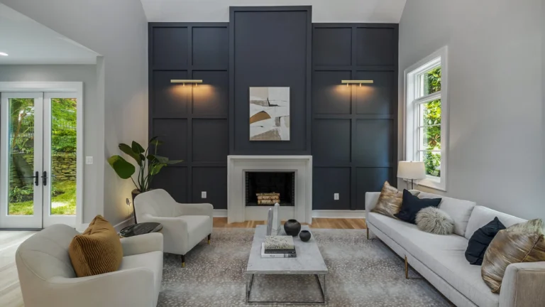 Custom family room with couches, fireplace, chairs and table.
